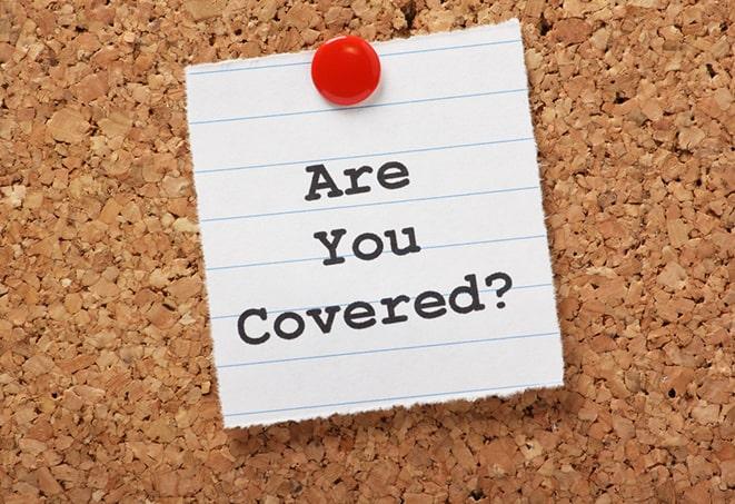 a motorcycle insurance agent explaining coverage options in Goldsby